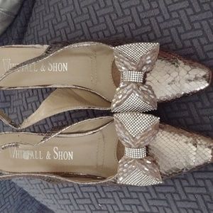 Shiny reptile kitten heels.